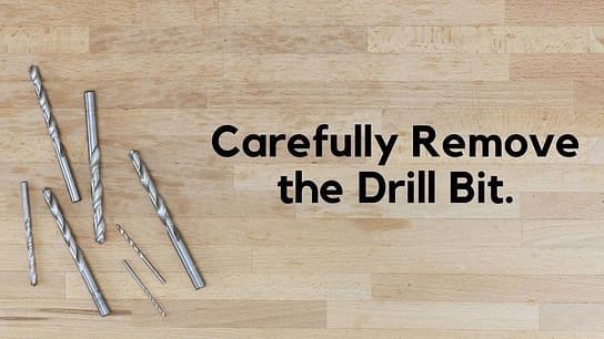 Carefully remove the drill bit.